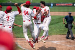 Andrew Schmit (right) celebrates his home run for St. John's Shrewsbury against St. John's Prep. (Patrick Donnelly/NEBJ)