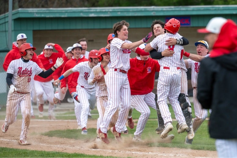 Natick celebrates its walk-off win over Braintree. (Patrick Donnelly/NEBJ)