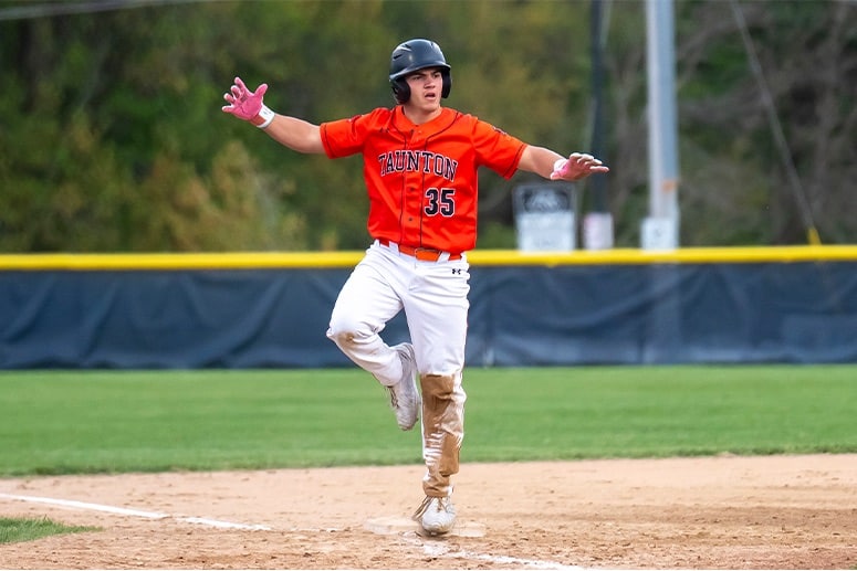 Dylan Keenan celebrates after his bases-clearing triple in the first inning against Franklin. (Patrick Donnelly/NEBJ)