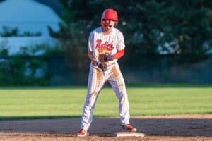 Luke Dougherty celebrates his first-inning double for Natick. (Patrick Donnelly/NEBJ)